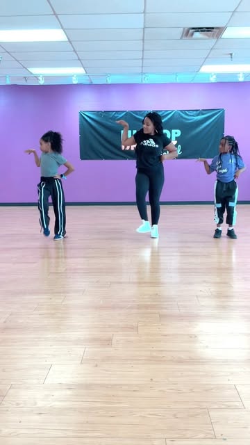 Three dancers practicing choreography in the Hip Hop Dreamz studio